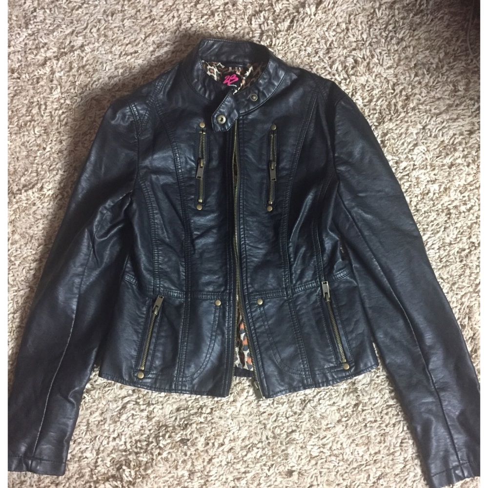 Bebe faux leather coat with leopard print lining.